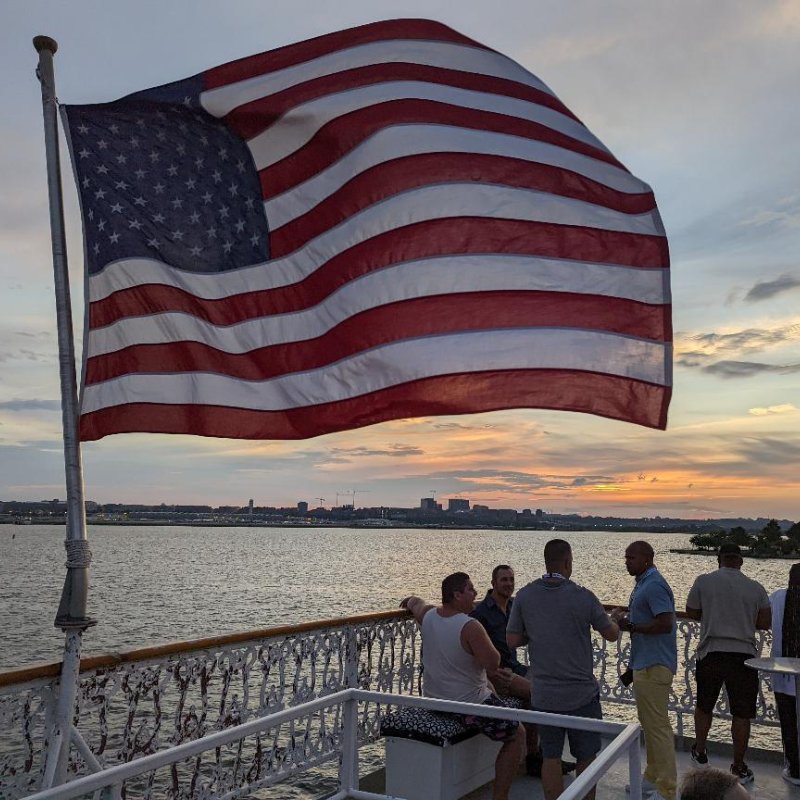 American flag flying on the stern of a boat.